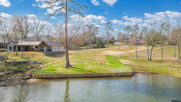 a view of a swimming pool with an outdoor space and seating area