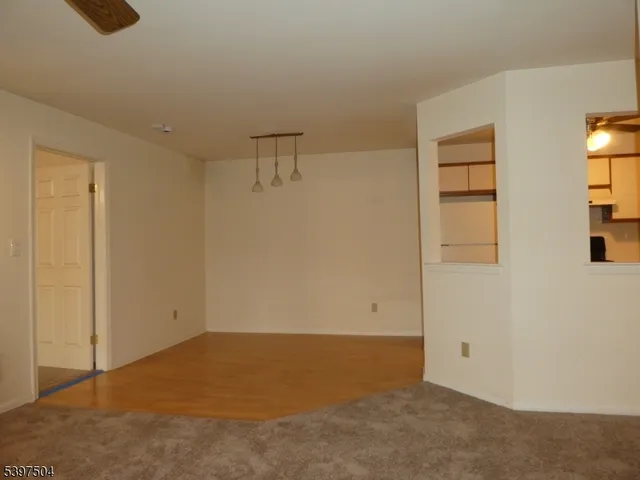 a view of a living room with granite countertop cabinets and a fireplace