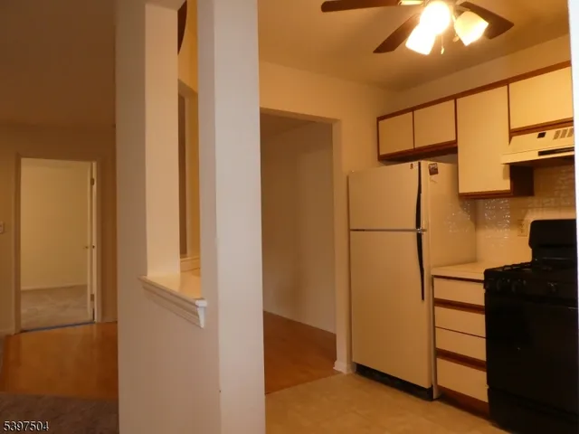 a kitchen with stainless steel appliances a stove sink and cabinets