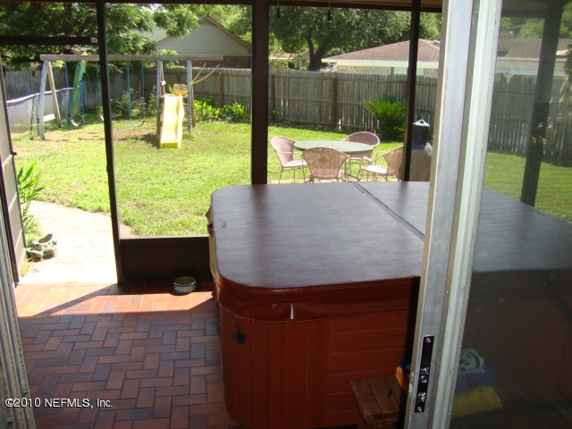 5911 Swamp Fox Road Jacksonville, FL 32210 - Photo 7 of 9 Screened Patio w/ Hot Tub