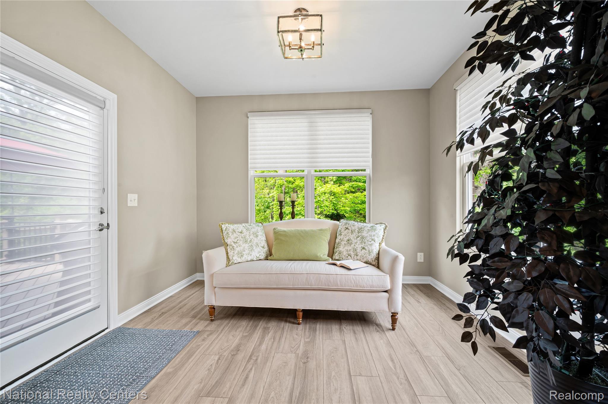 48796 Windfall Road Novi, MI 48374 - Photo 6 of 30 Light wood-finish flooring complements neutral wall tones in this inviting space