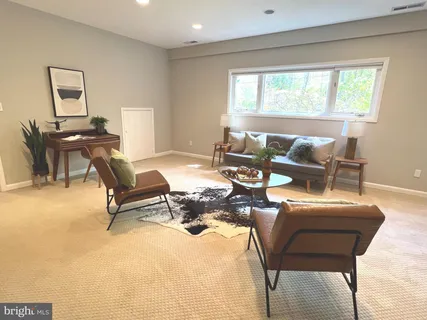 a view of a backyard with sitting area