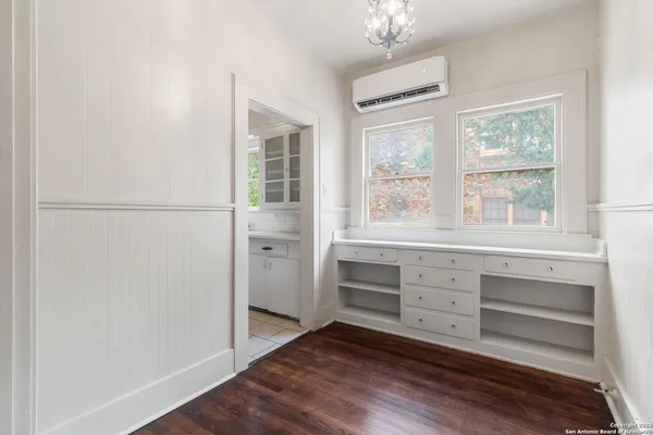 a room with cabinets and a window