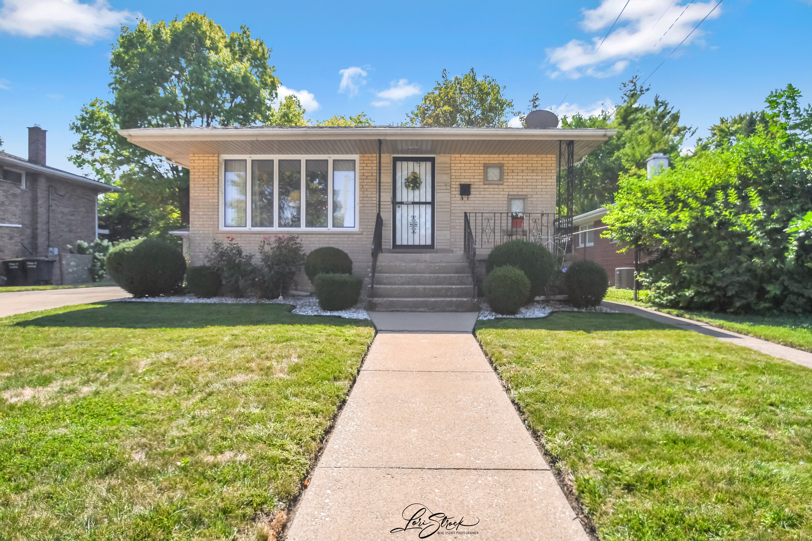 3409 173rd Place Lansing, IL 60438 - Photo 1 of 26 a front view of a house with garden