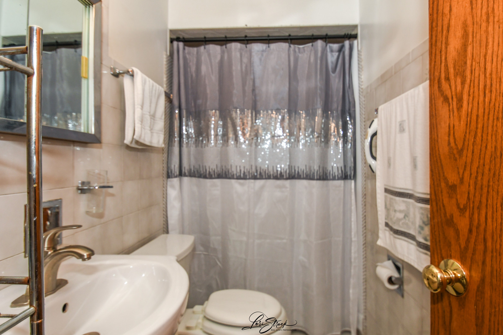 3409 173rd Place Lansing, IL 60438 - Photo 15 of 26 a bathroom with a sink toilet and shower
