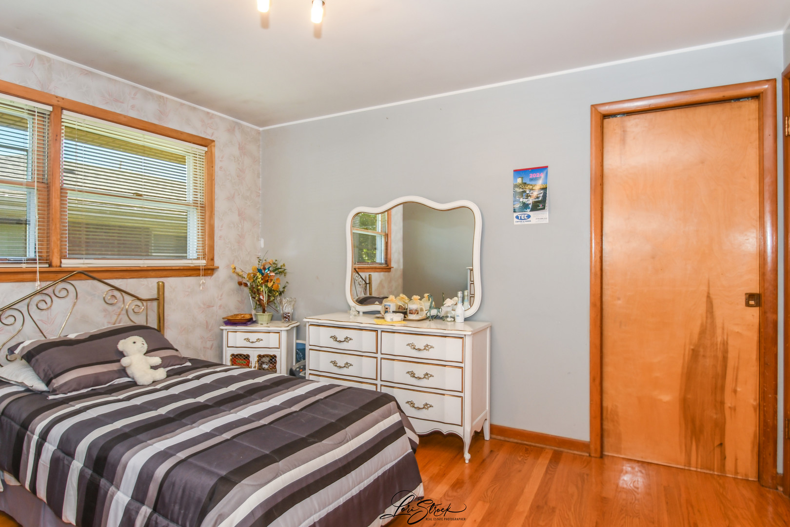 3409 173rd Place Lansing, IL 60438 - Photo 16 of 26 a bedroom with a bed and a dresser