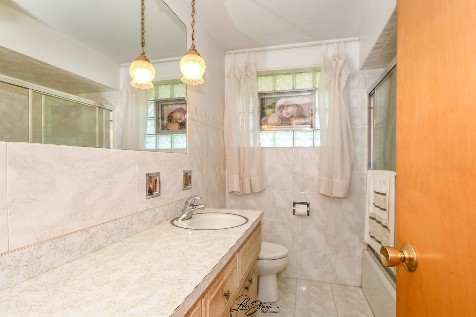 3409 173rd Place Lansing, IL 60438 - Photo 7 of 26 a bathroom with a granite countertop sink mirror and a toilet