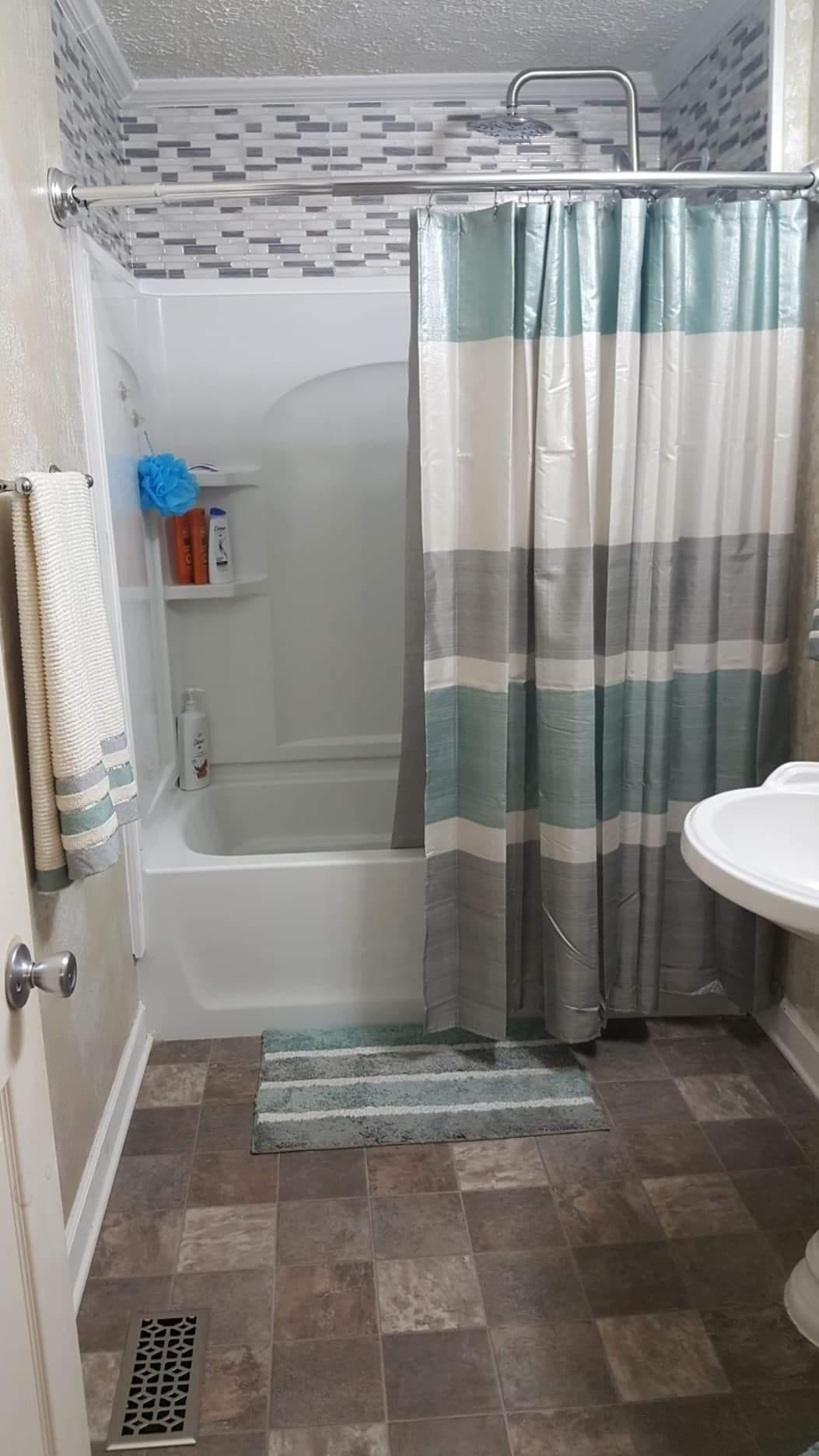 2154 Union Camp Road Lafayette, TN 37083 - Photo 18 of 23 a bathroom with a toilet and a shower