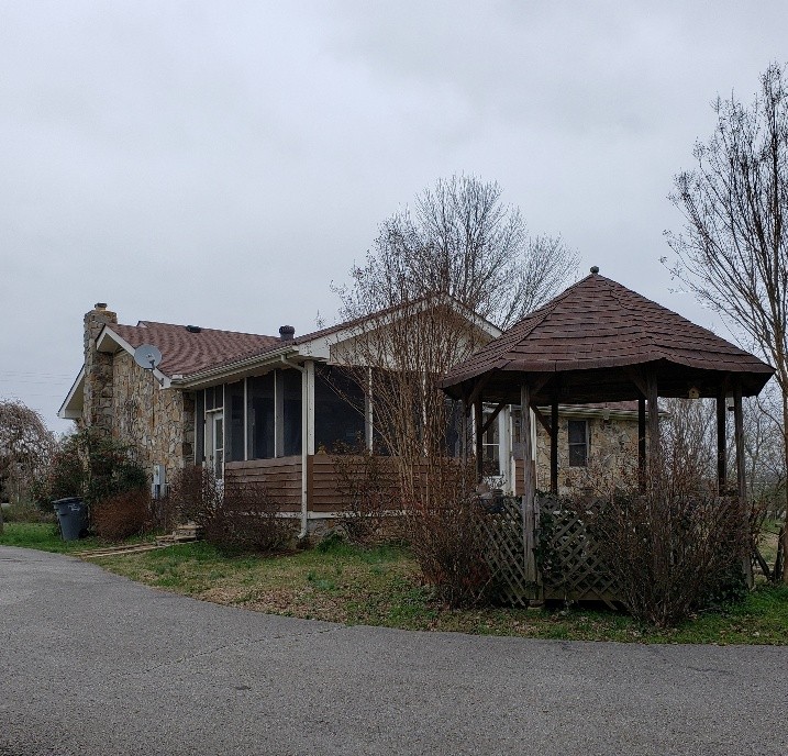 2154 Union Camp Road Lafayette, TN 37083 - Photo 22 of 23 a view of a house with yard and plants