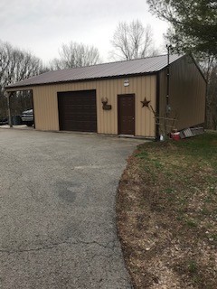 2154 Union Camp Road Lafayette, TN 37083 - Photo 3 of 23 a front view of house with garage