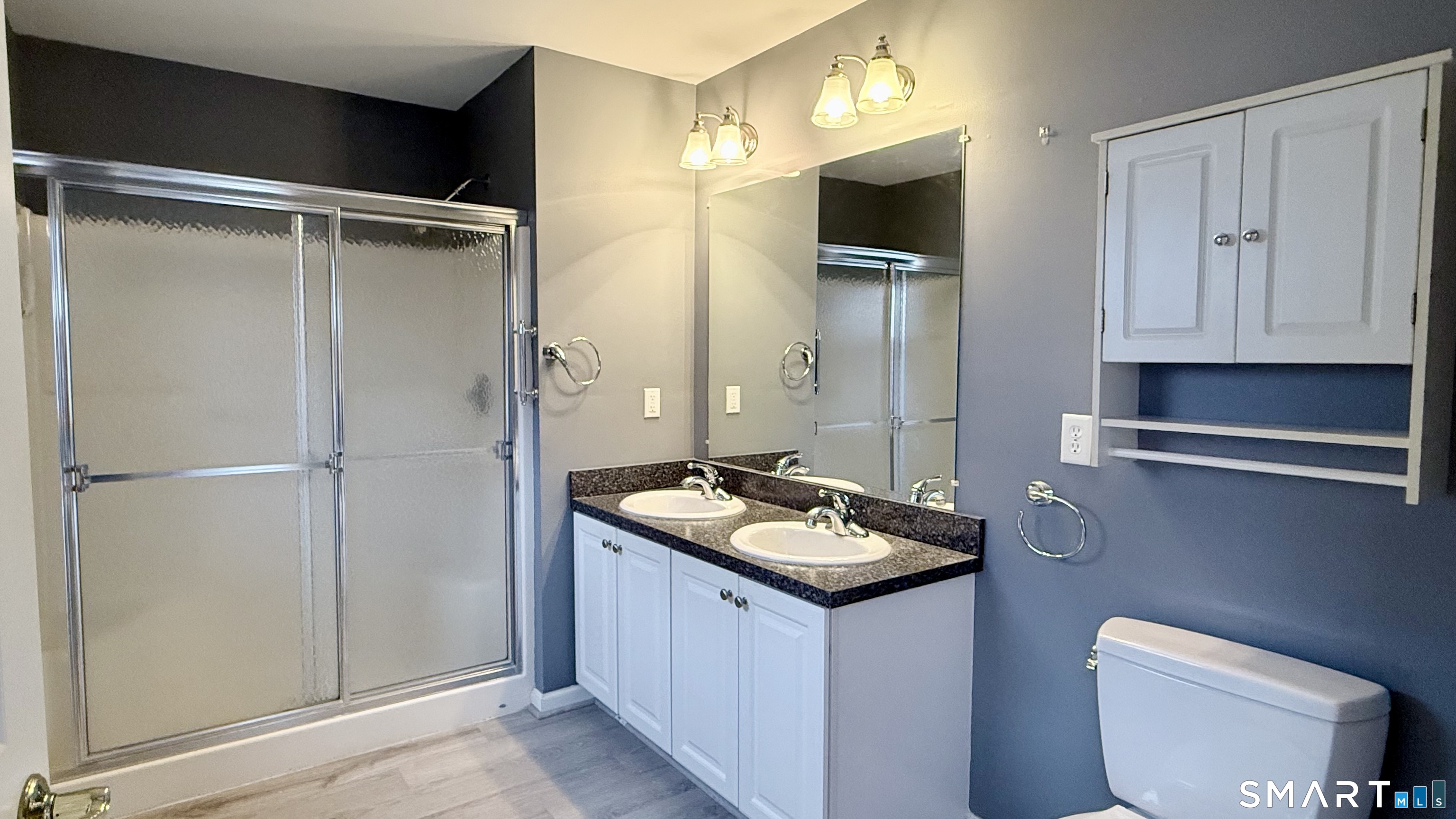 55 Nina's Way, Unit 55 Manchester, CT 06040 - Photo 11 of 25 a bathroom with a sink a toilet and shower