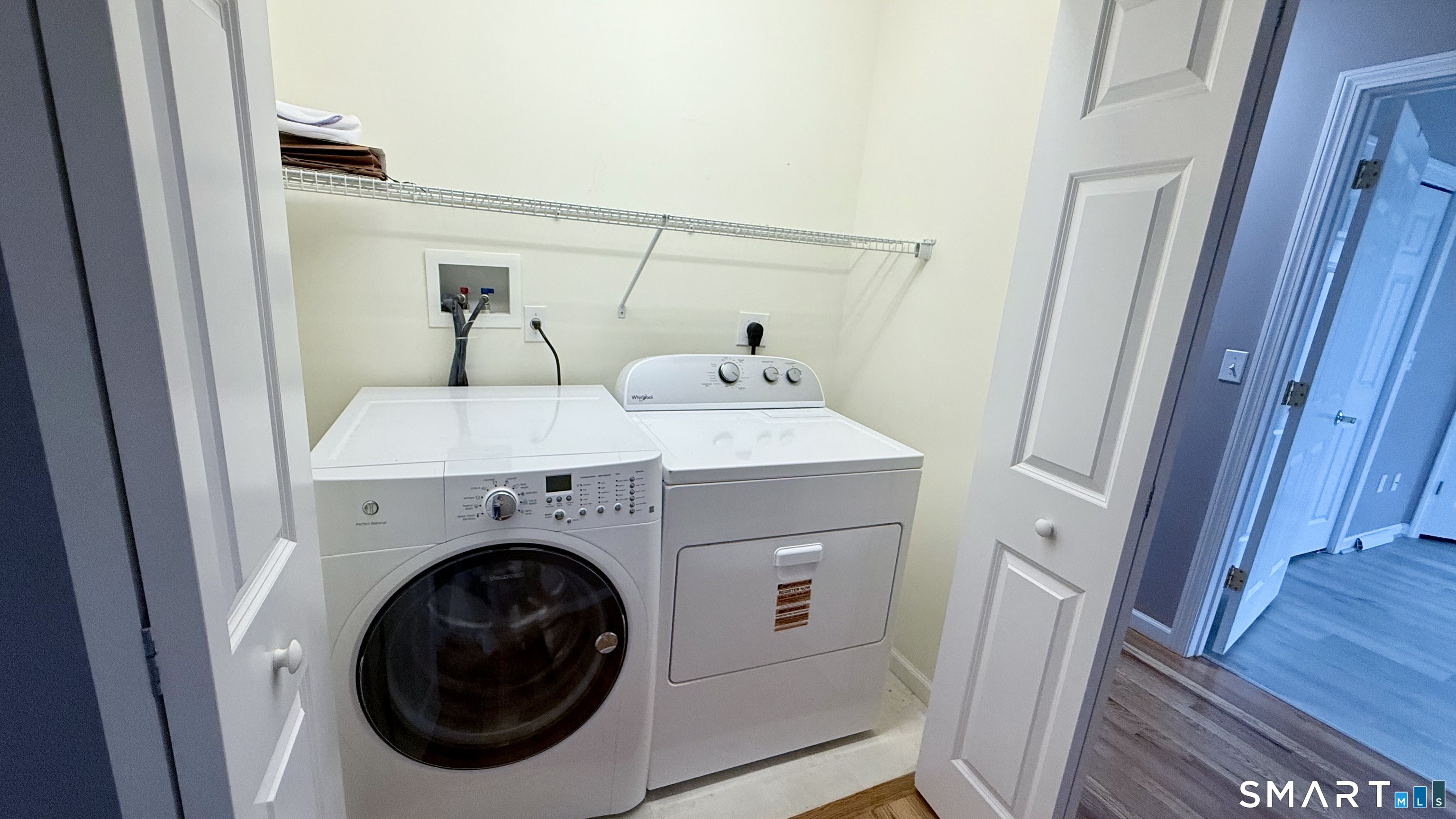 55 Nina's Way, Unit 55 Manchester, CT 06040 - Photo 12 of 25 a utility room with dryer and washer