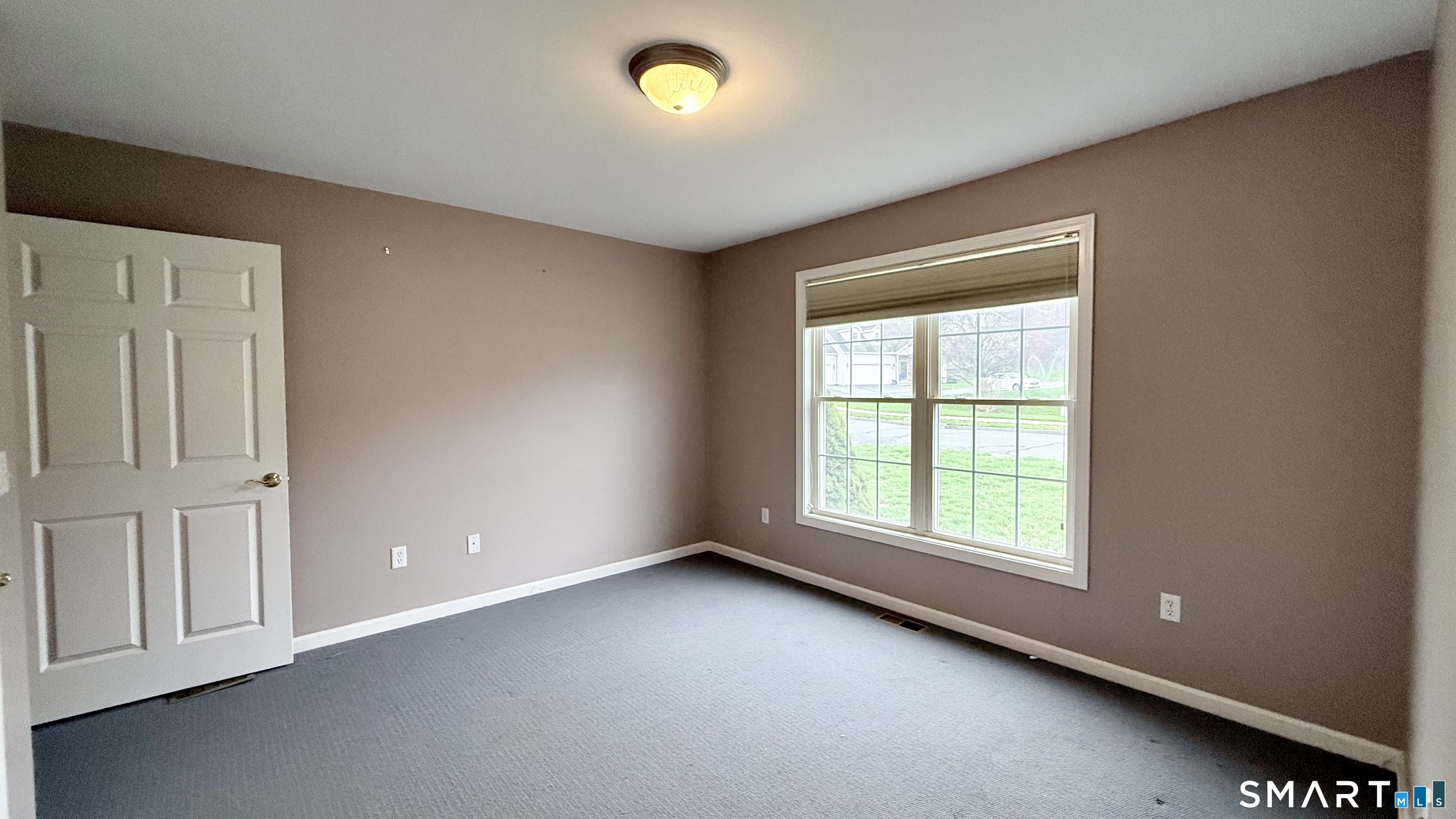 55 Nina's Way, Unit 55 Manchester, CT 06040 - Photo 13 of 25 an empty room with windows