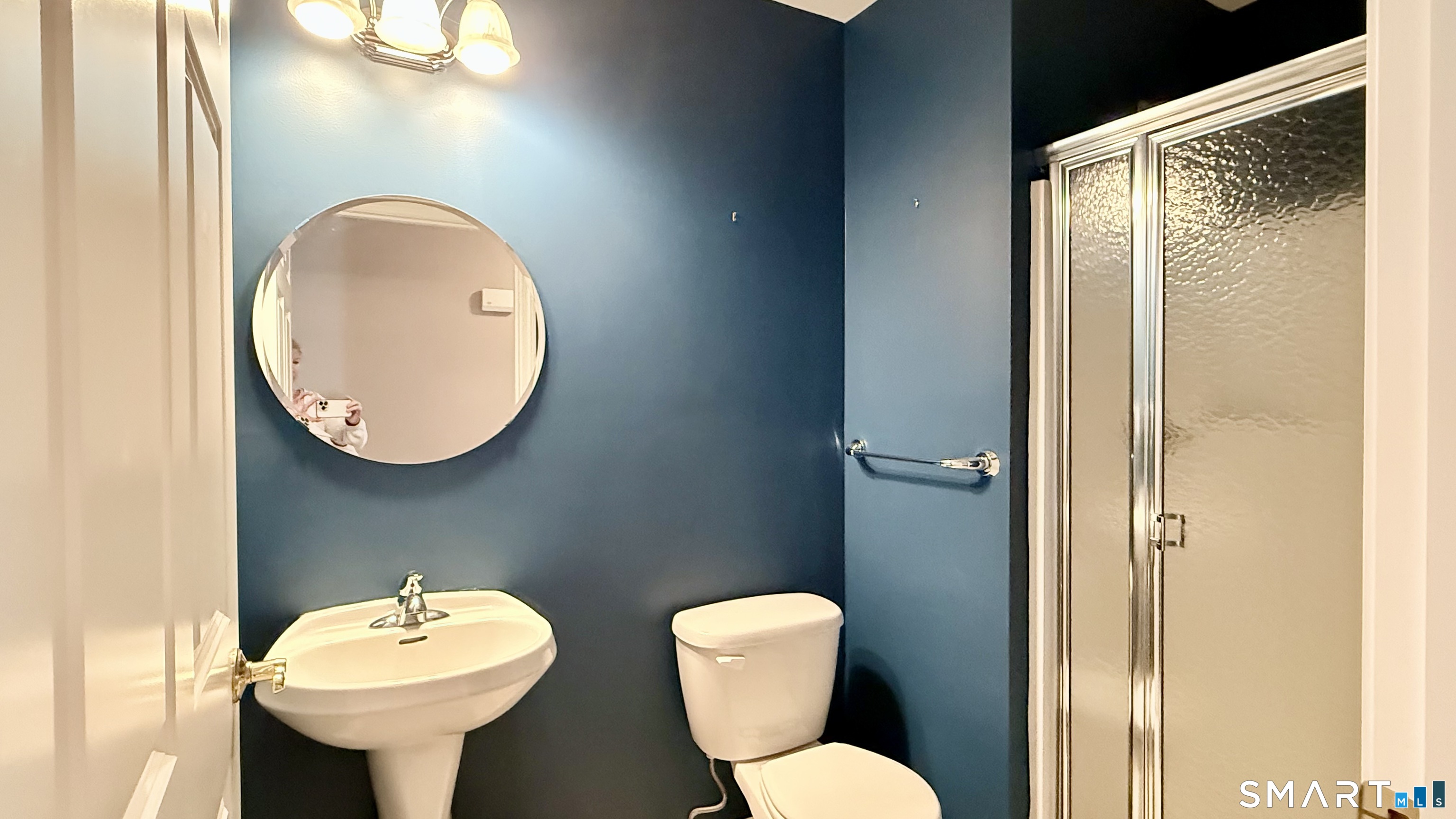 55 Nina's Way, Unit 55 Manchester, CT 06040 - Photo 15 of 25 a bathroom with a toilet sink and mirror