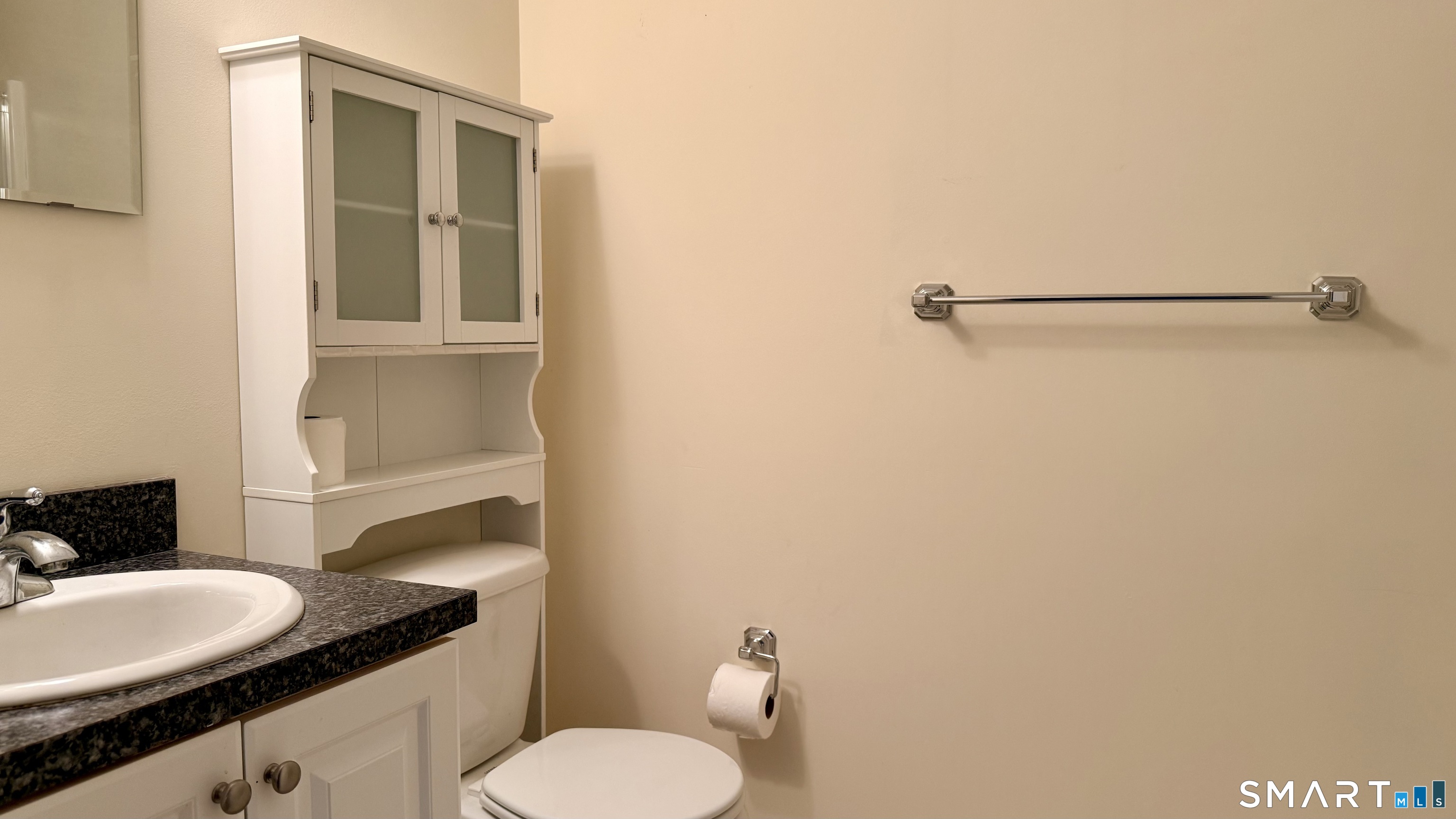 55 Nina's Way, Unit 55 Manchester, CT 06040 - Photo 19 of 25 a bathroom with a granite countertop sink and a mirror