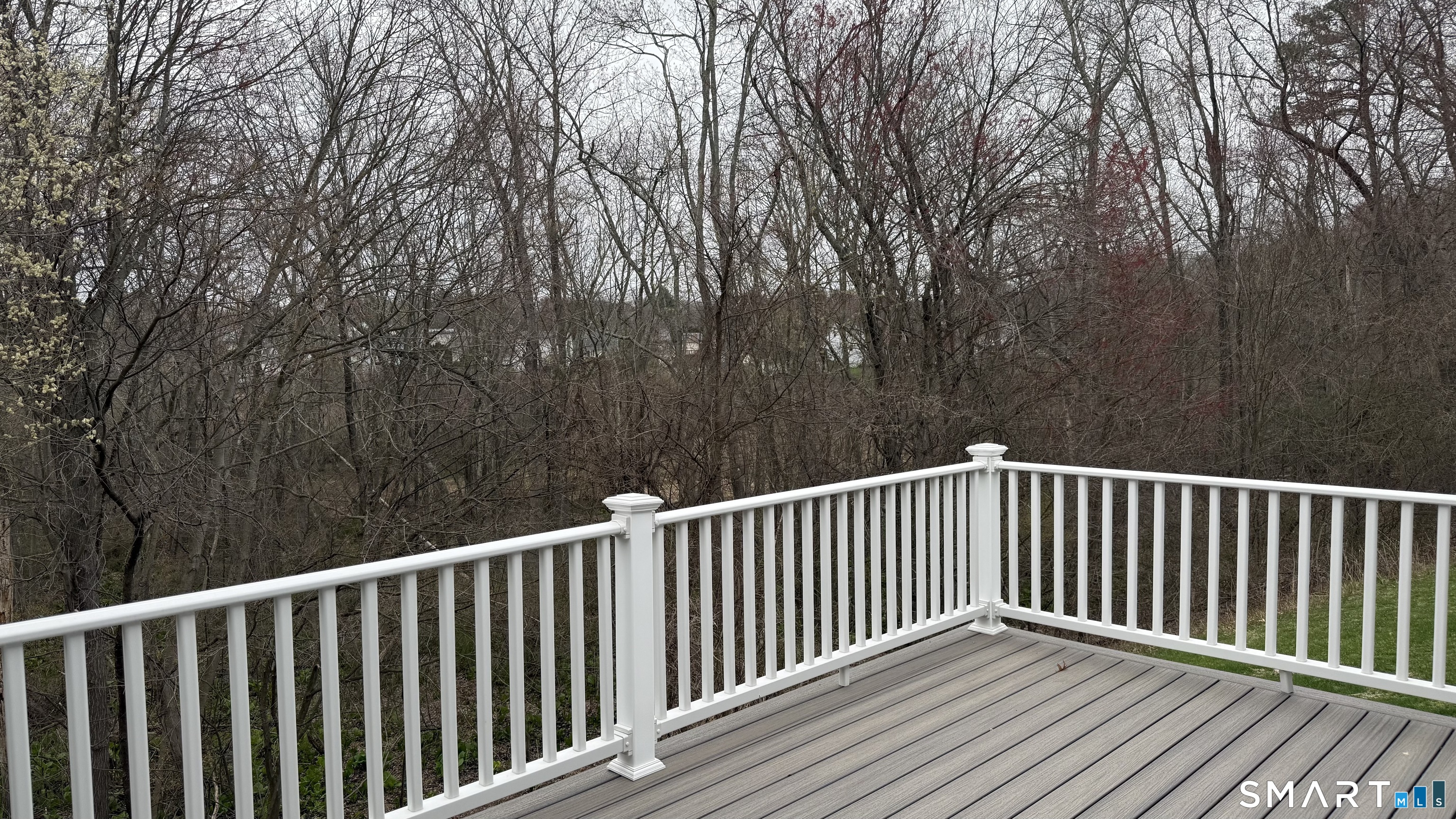 55 Nina's Way, Unit 55 Manchester, CT 06040 - Photo 23 of 25 a view of balcony with wooden floor and fence