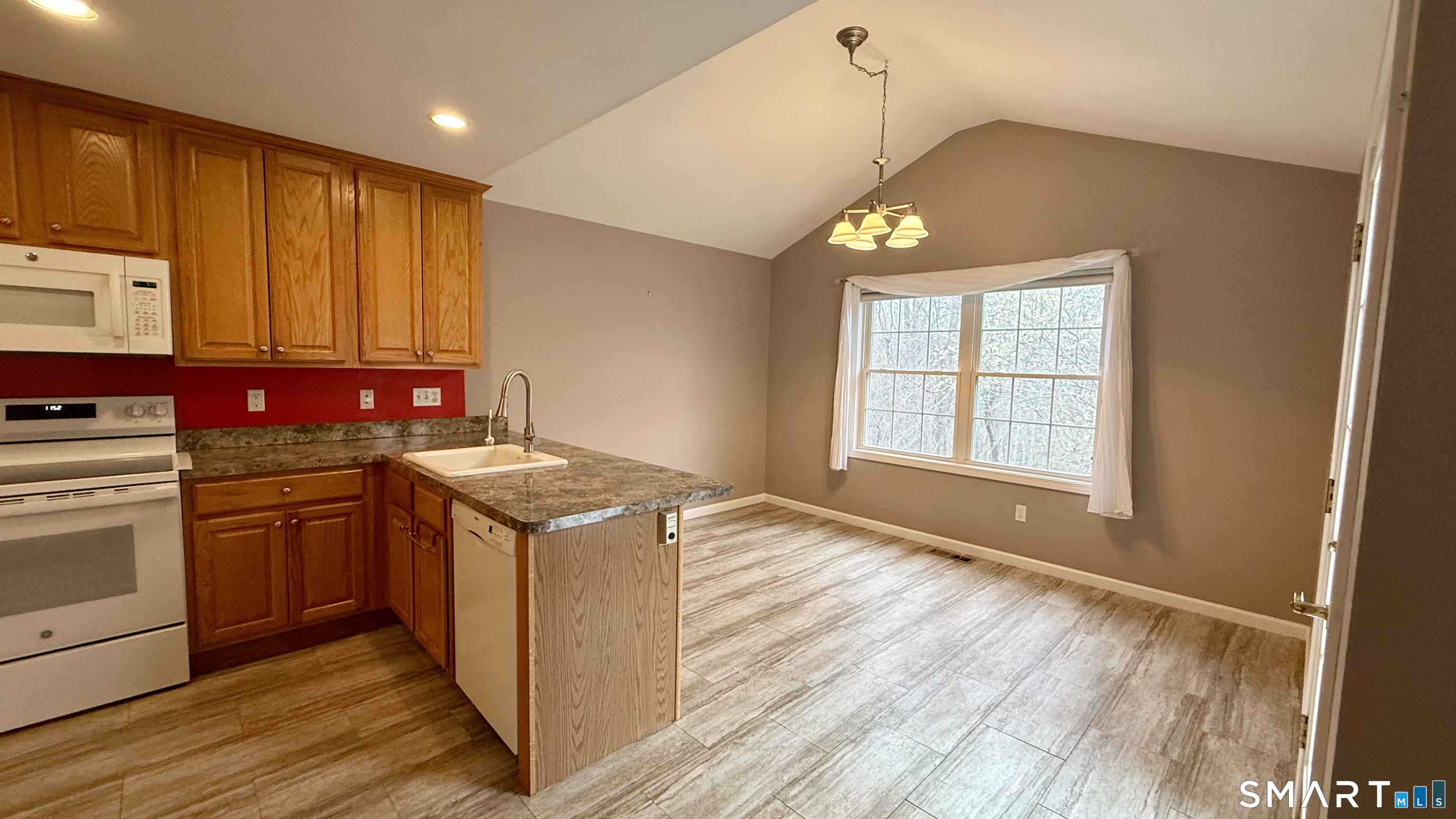 55 Nina's Way, Unit 55 Manchester, CT 06040 - Photo 5 of 25 a kitchen with stainless steel appliances granite countertop a stove and a sink