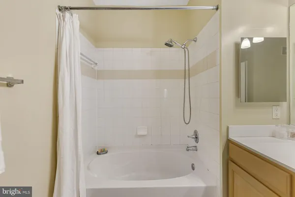 a bathroom with a bathtub and a sink