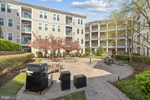 a view of a patio with table and chairs and potted plants