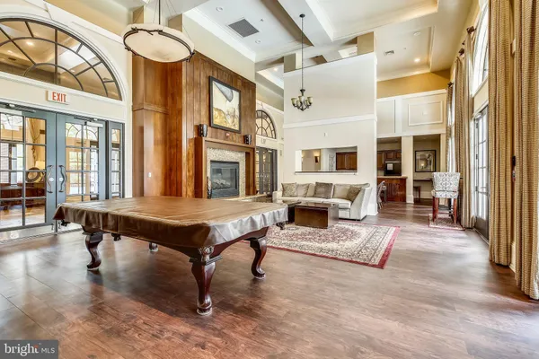 a bedroom with furniture and a large window