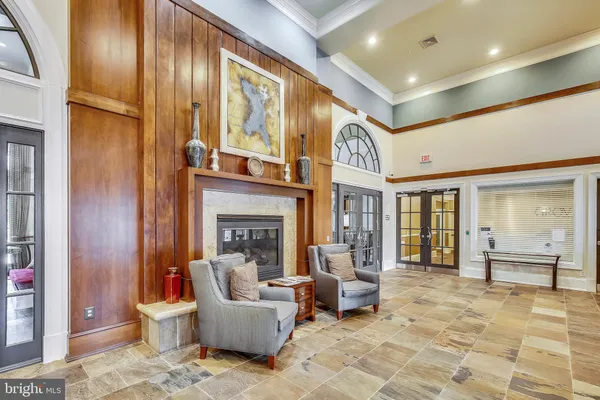 a reading room with furniture and book shelf