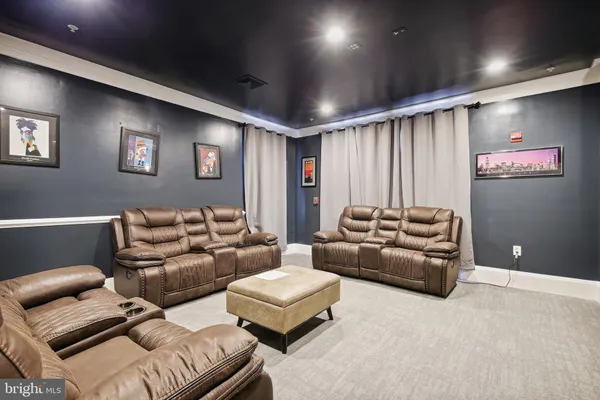 a living room with furniture and a projector