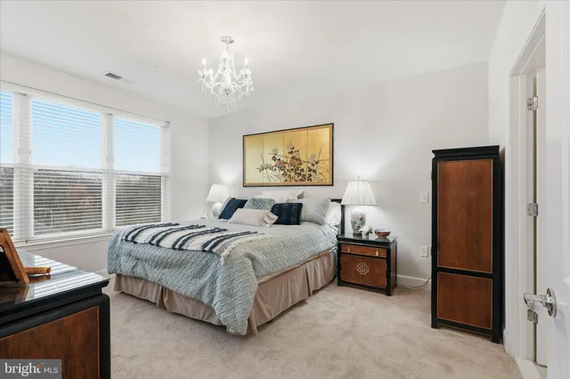 a bathroom with a double vanity sink mirror and shower