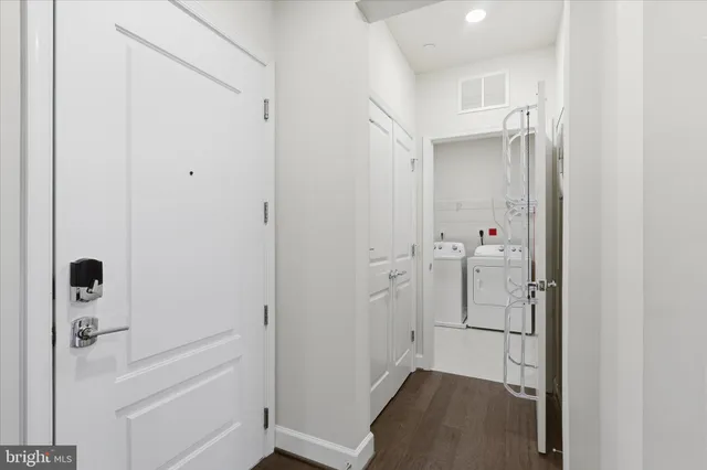 a view of a bike storage and utility room with bicycles