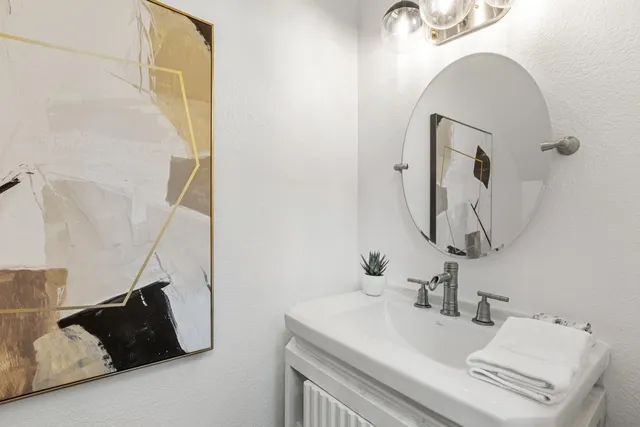 a bathroom with a sink and mirror