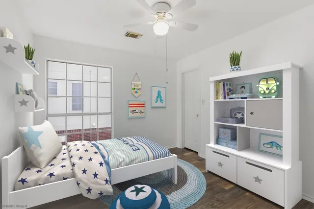 a bedroom with a bed and a window