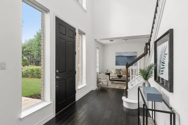 a dining room with furniture and wooden floor