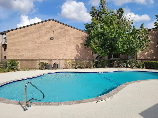a view of a swimming pool and outdoor space