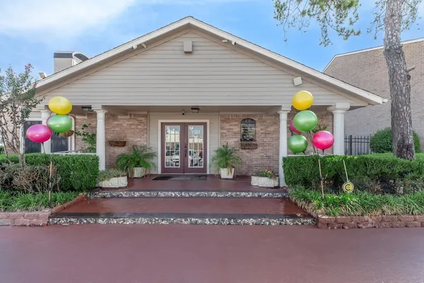 a front view of house with yard and outdoor seating
