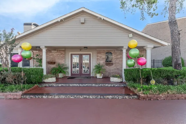 a front view of house with yard and outdoor seating