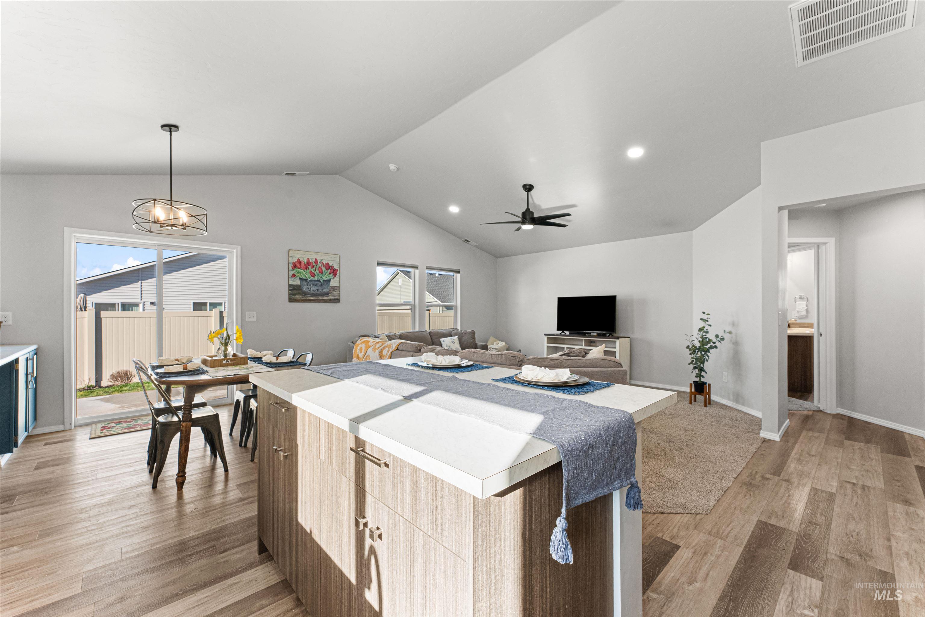 12342 Noreen Street Caldwell, ID 83607 - Photo 42 of 42 Kitchen with light countertops, open floor plan, light wood finished floors, and a center island