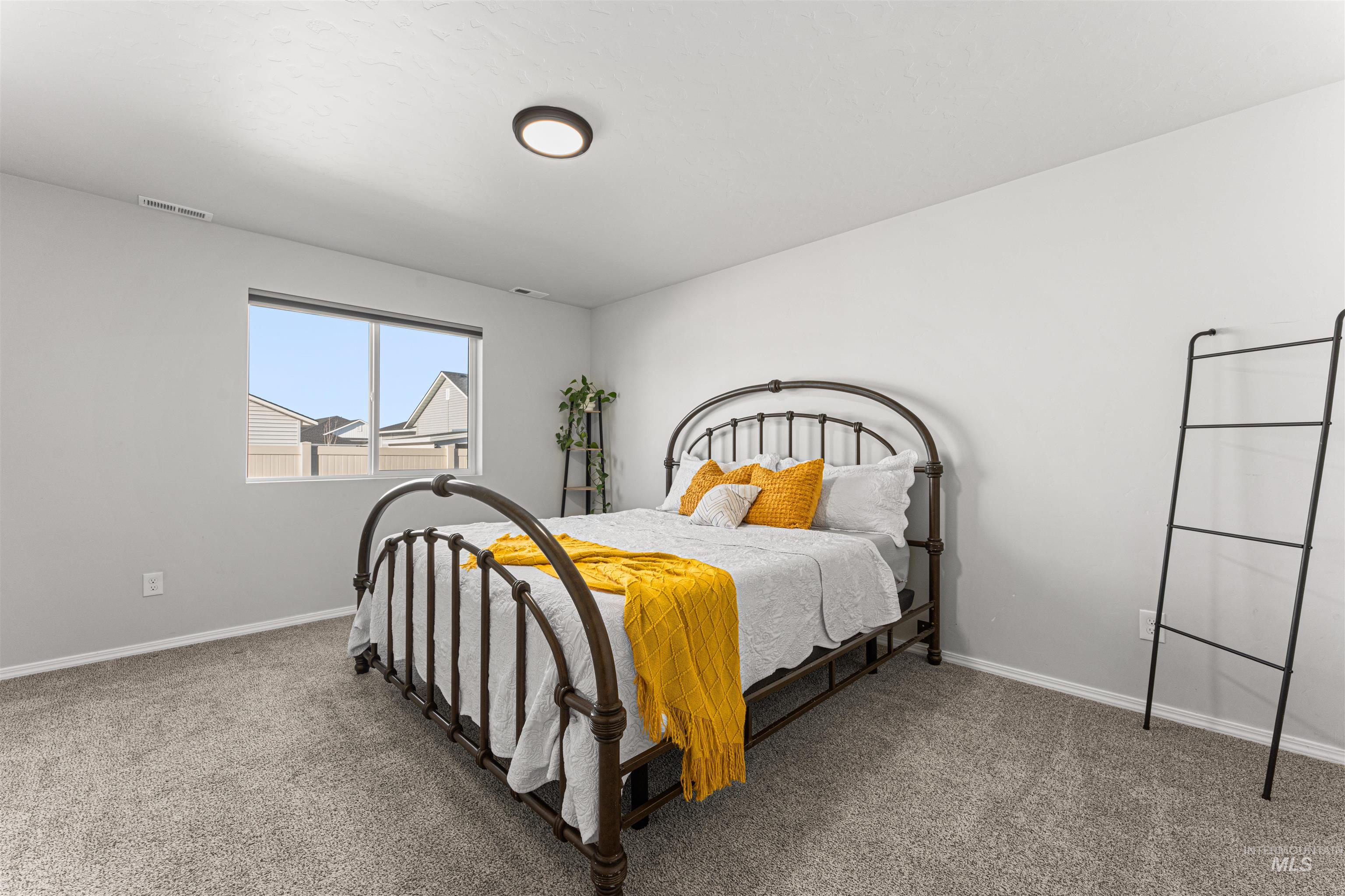 12342 Noreen Street Caldwell, ID 83607 - Photo 24 of 42 Bedroom featuring baseboards and light colored carpet