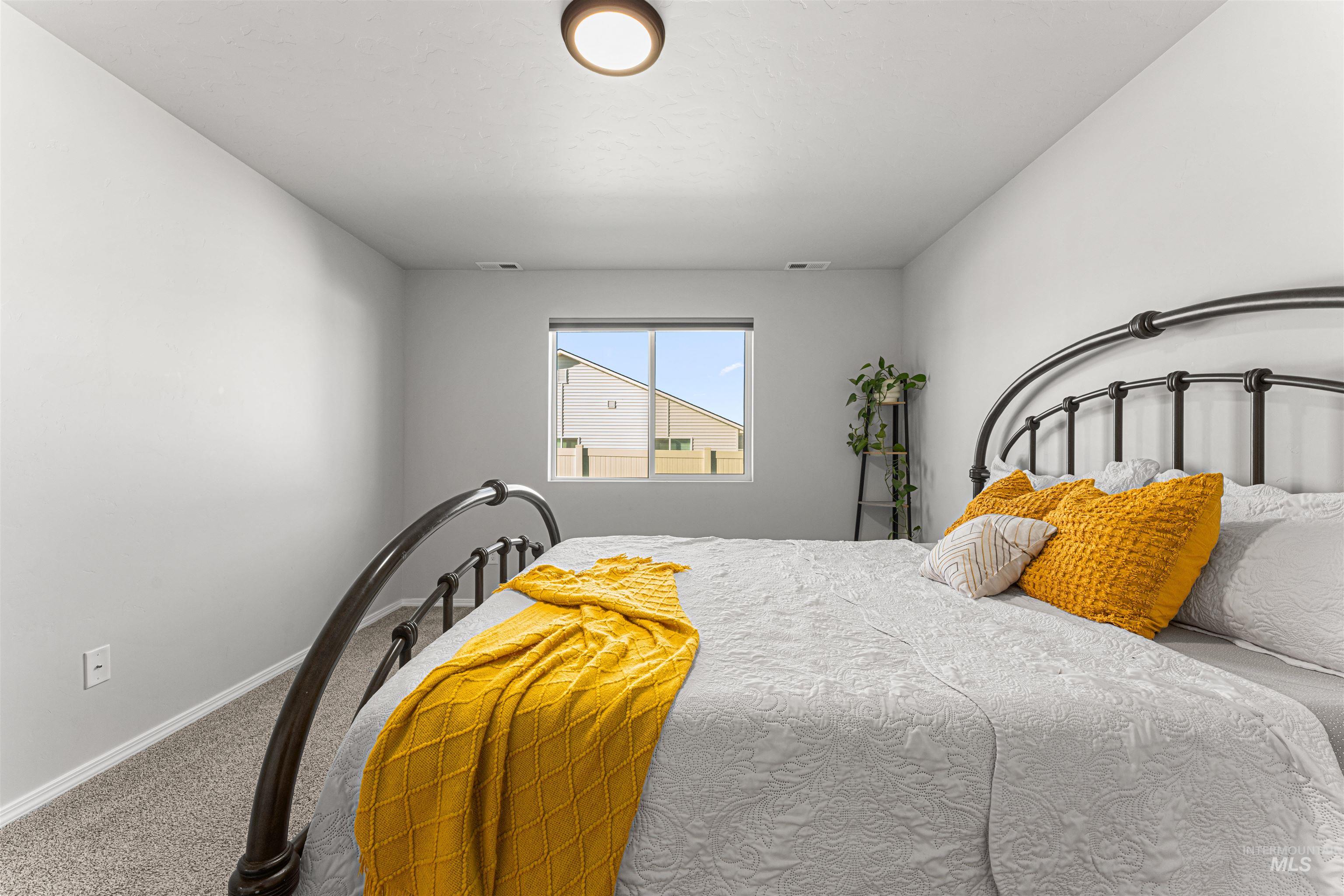 12342 Noreen Street Caldwell, ID 83607 - Photo 26 of 42 Carpeted bedroom with baseboards