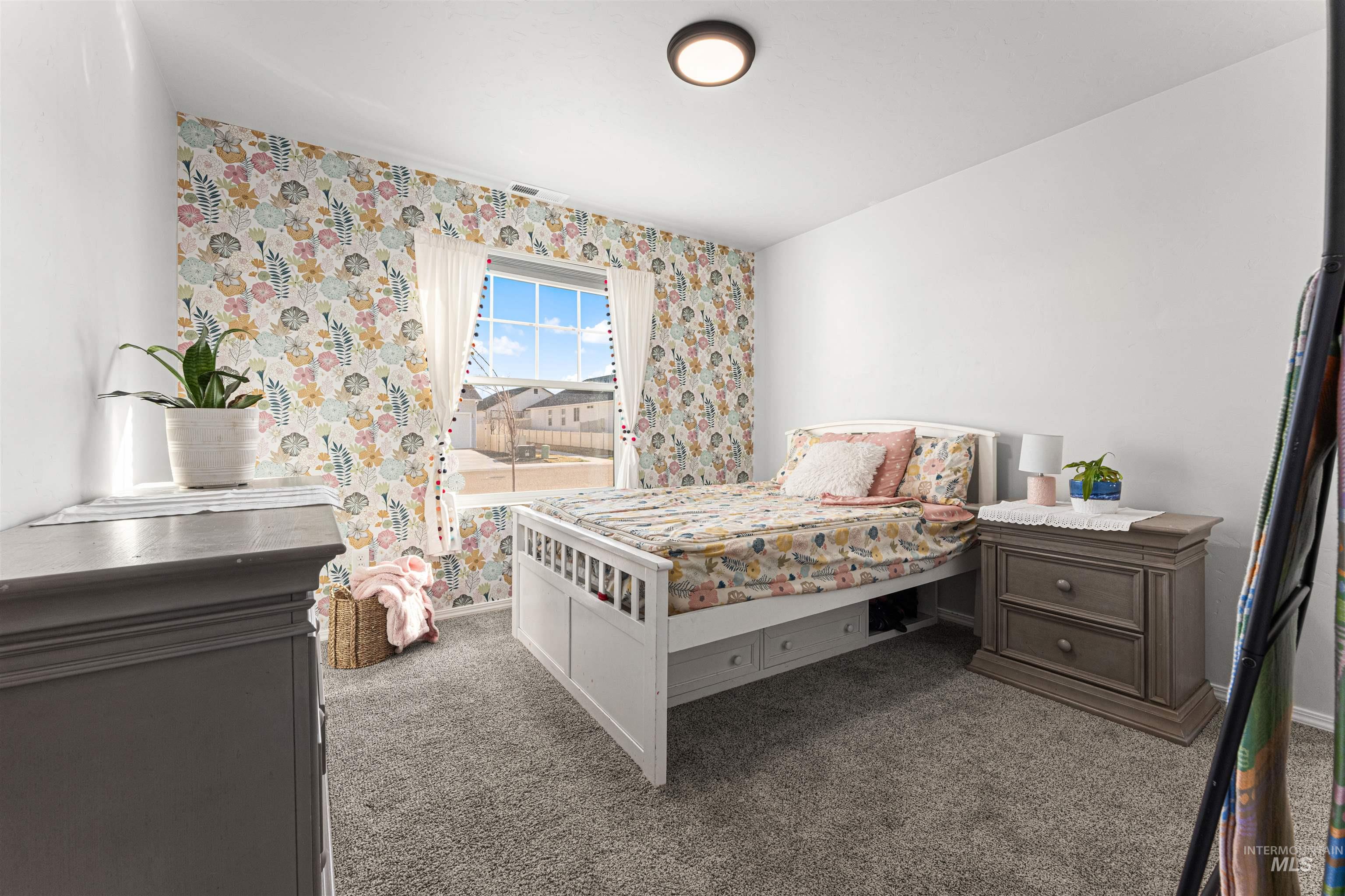 12342 Noreen Street Caldwell, ID 83607 - Photo 31 of 42 Bedroom featuring carpet floors and wallpapered walls