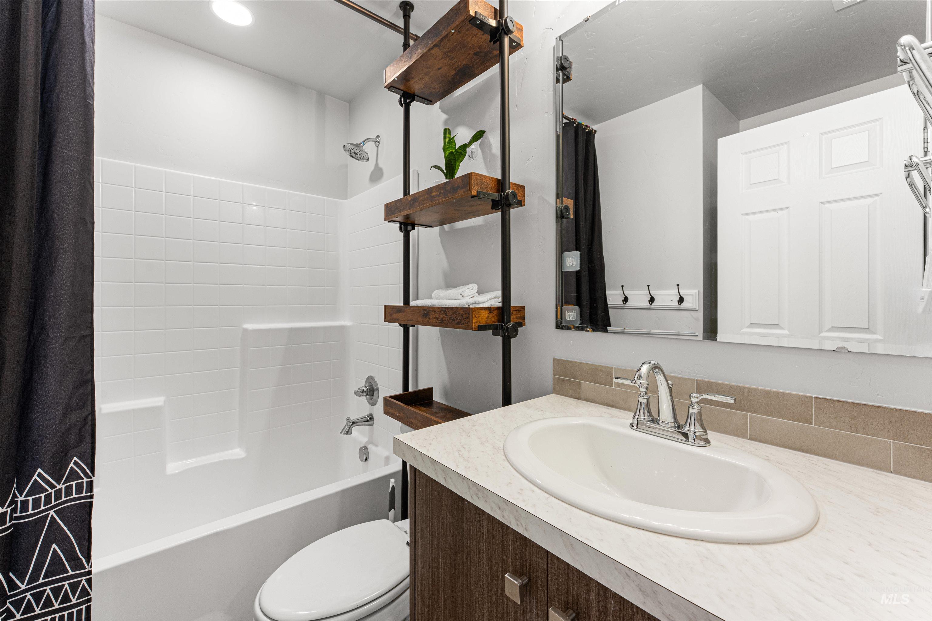 12342 Noreen Street Caldwell, ID 83607 - Photo 33 of 42 Bathroom featuring vanity and shower / bath combination with curtain