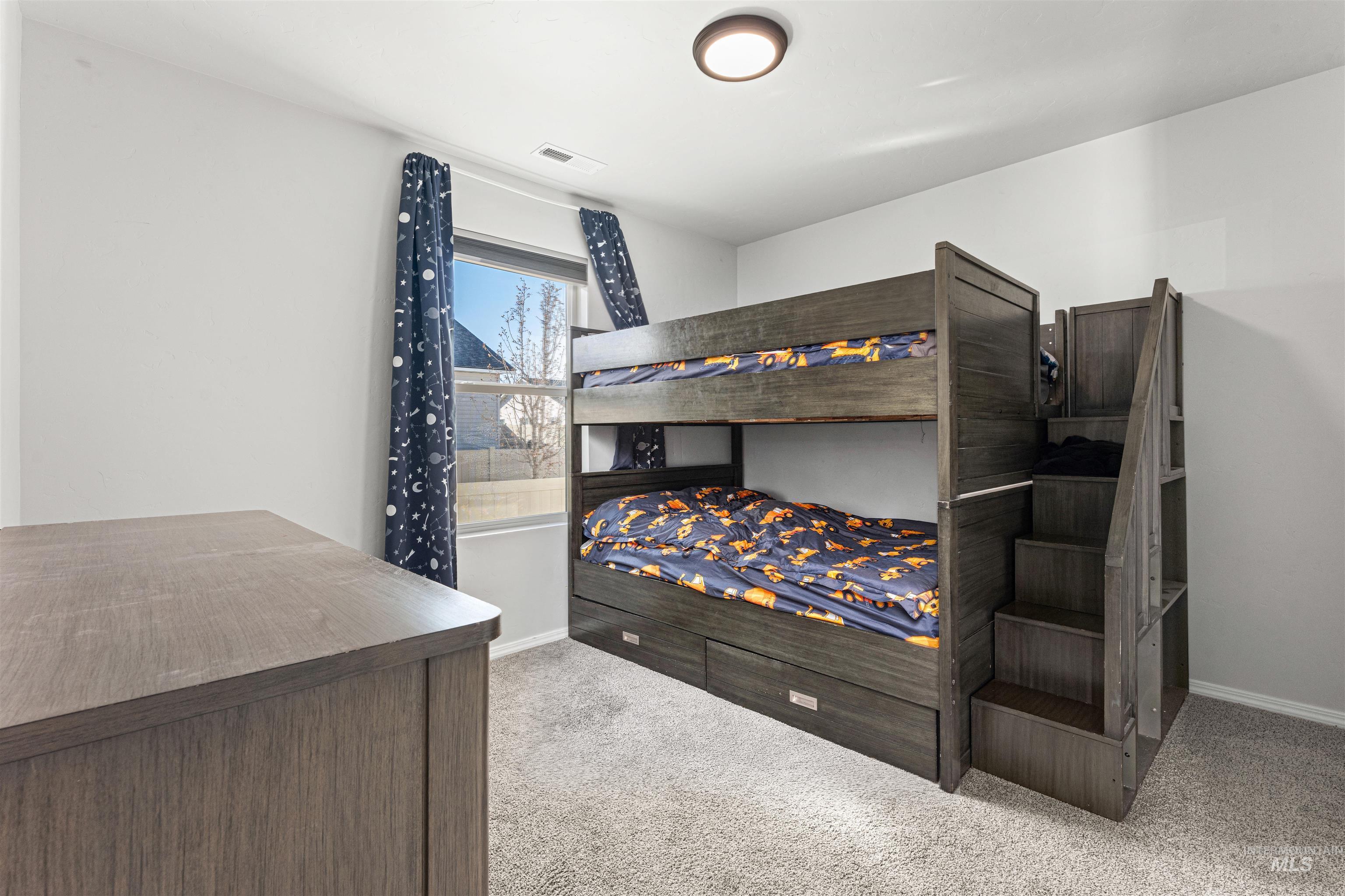 12342 Noreen Street Caldwell, ID 83607 - Photo 34 of 42 Bedroom featuring light colored carpet and baseboards