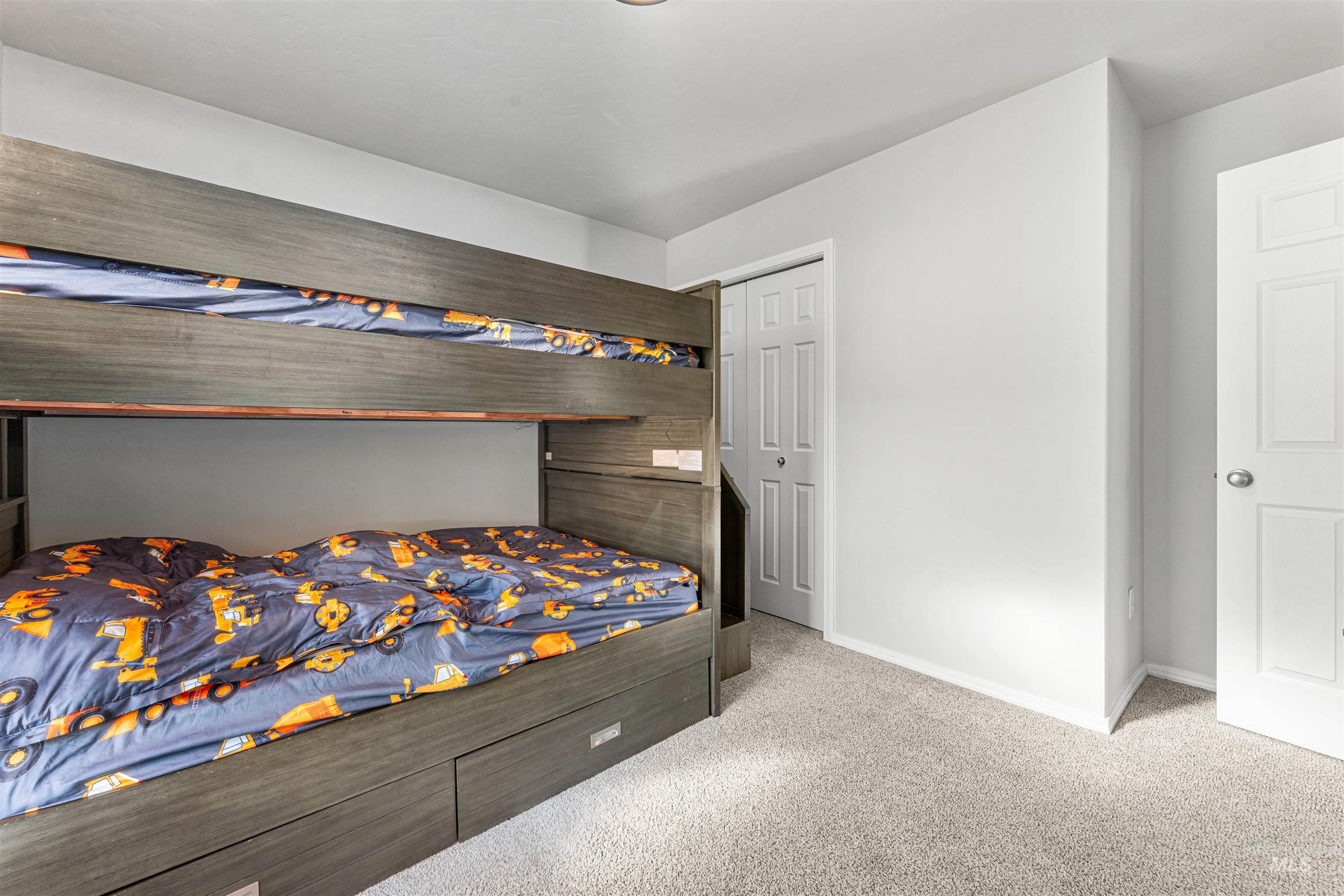 12342 Noreen Street Caldwell, ID 83607 - Photo 35 of 42 Bedroom with light carpet and a closet