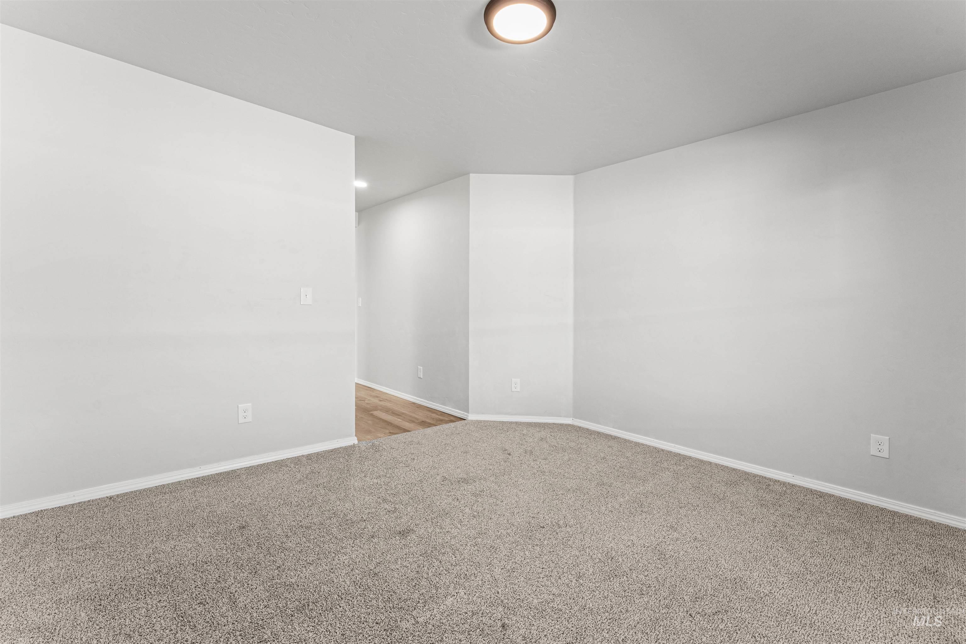 12342 Noreen Street Caldwell, ID 83607 - Photo 38 of 42 Unfurnished room featuring baseboards and light carpet