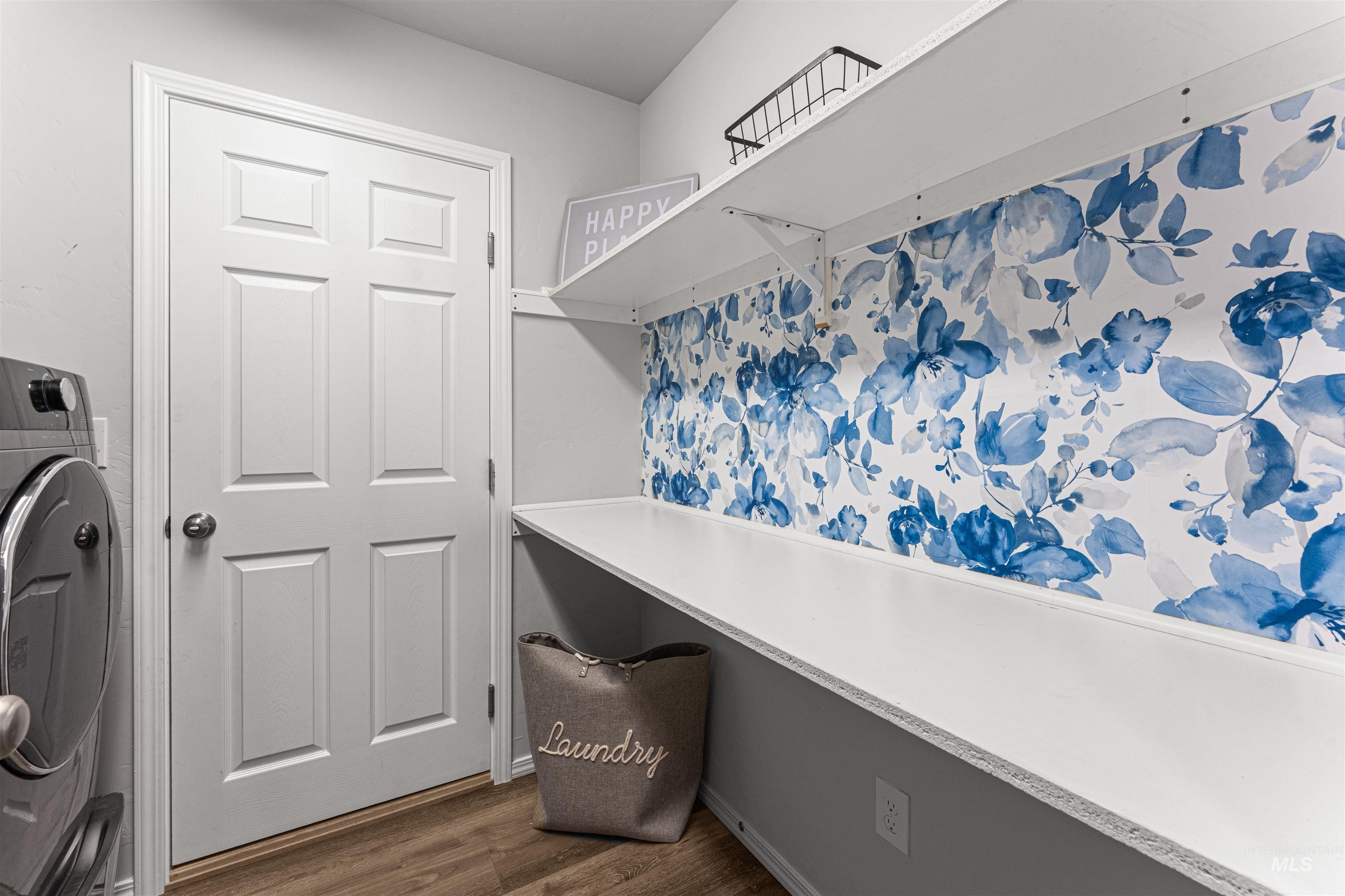 12342 Noreen Street Caldwell, ID 83607 - Photo 39 of 42 Laundry area with washer / clothes dryer and dark wood-style floors