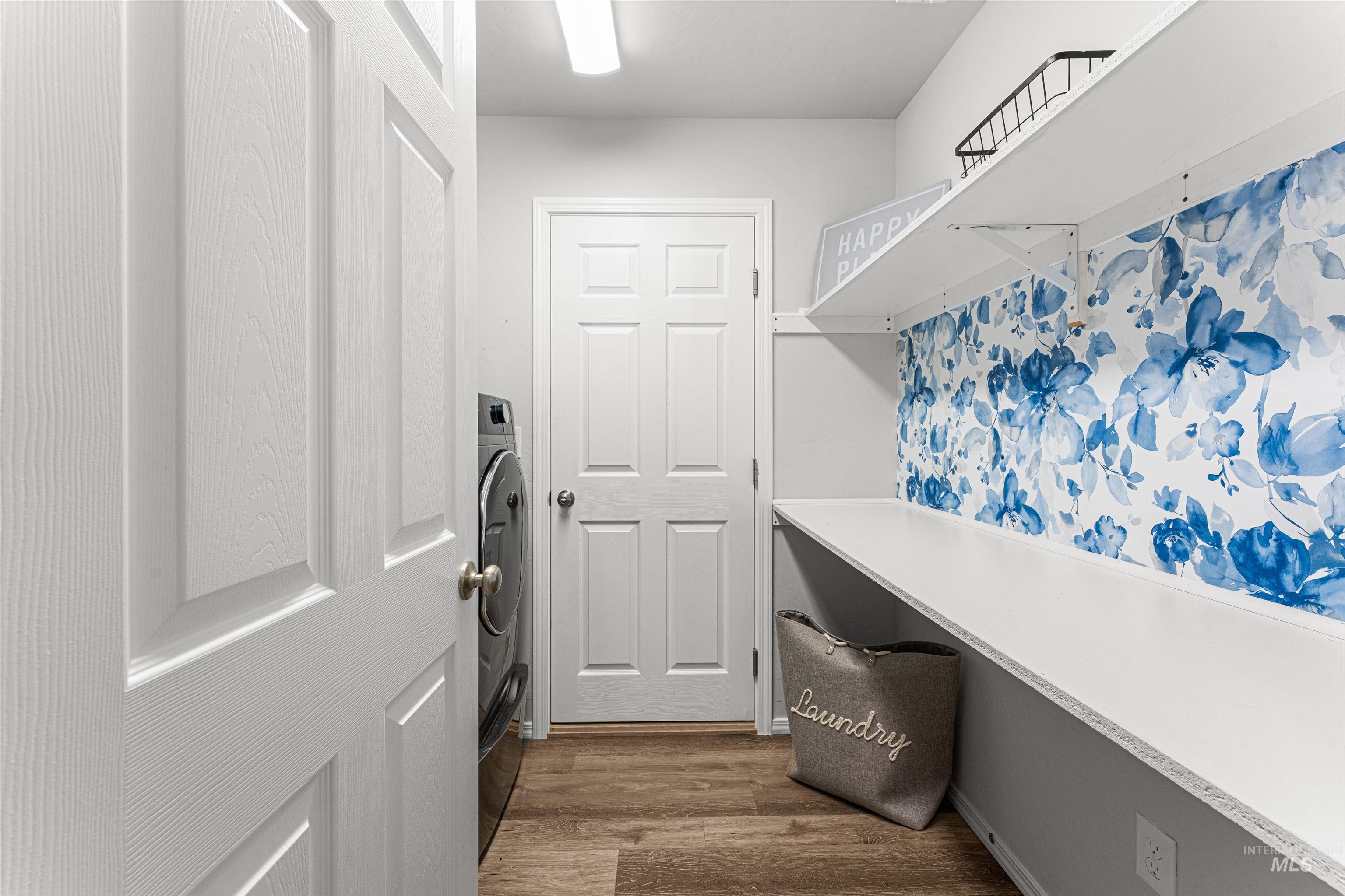 12342 Noreen Street Caldwell, ID 83607 - Photo 40 of 42 Laundry area featuring dark wood-type flooring and washer / dryer
