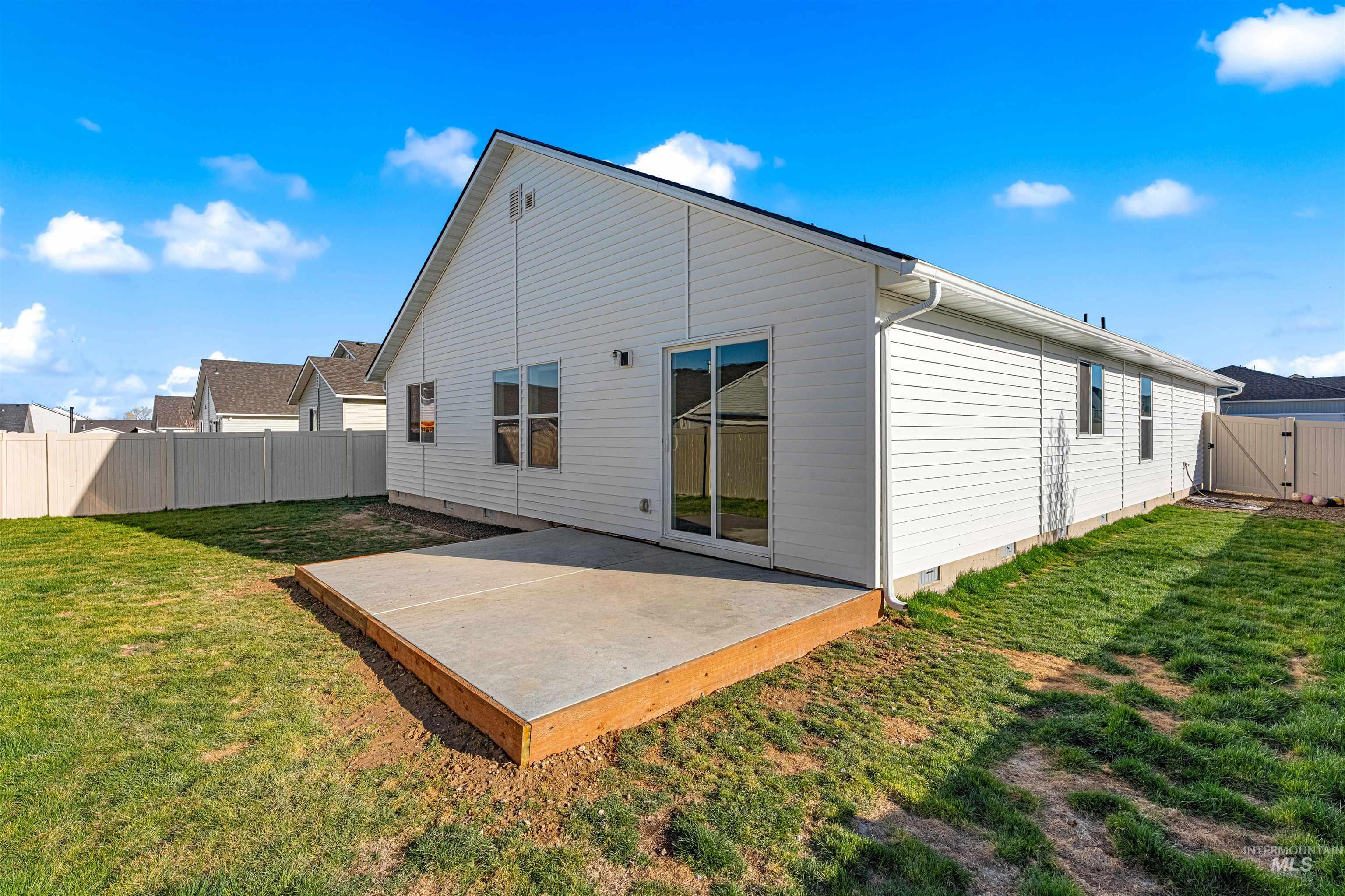 12342 Noreen Street Caldwell, ID 83607 - Photo 6 of 42 Back of house with a gate, a fenced backyard, crawl space, and a patio