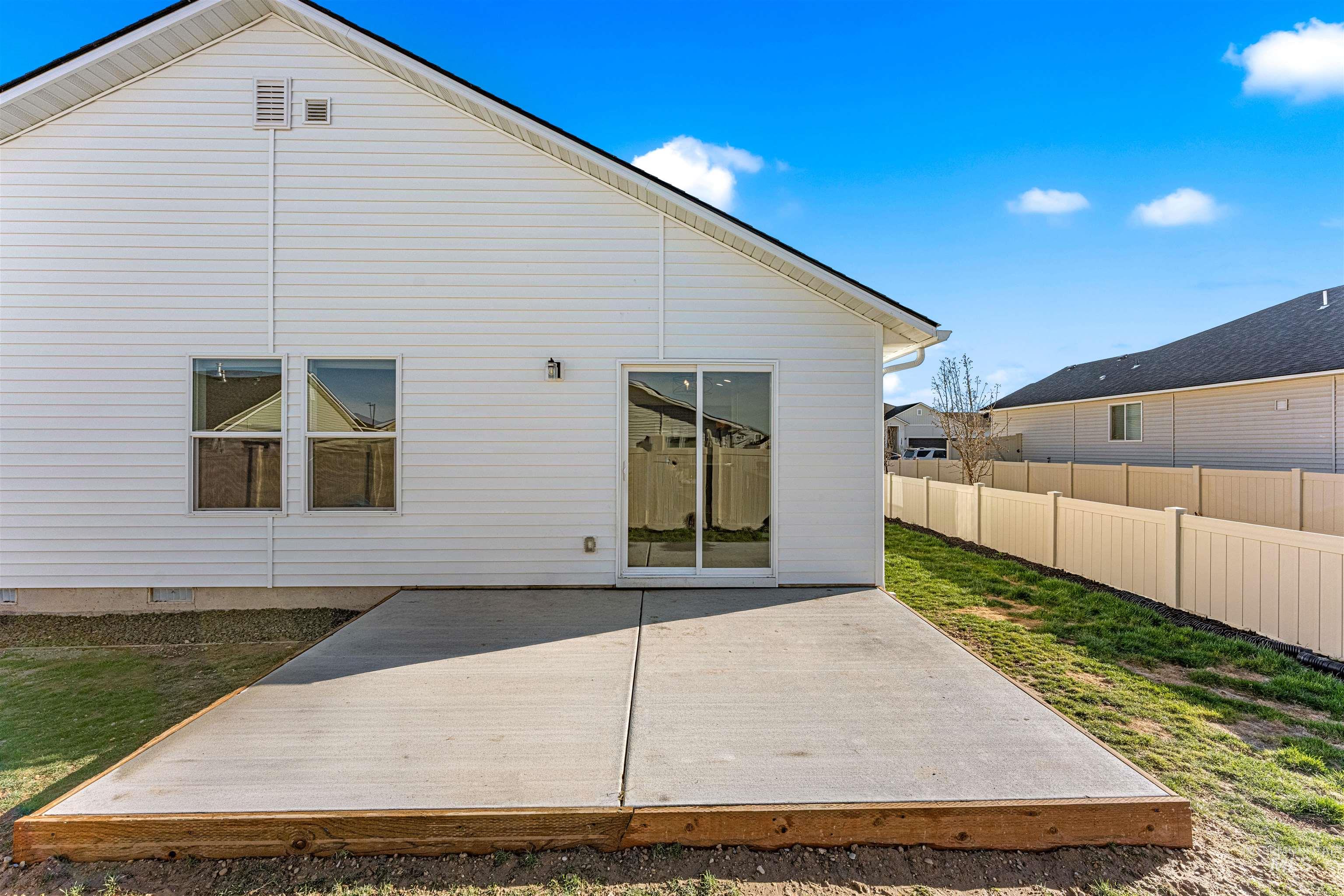 12342 Noreen Street Caldwell, ID 83607 - Photo 7 of 42 Rear view of house with a deck