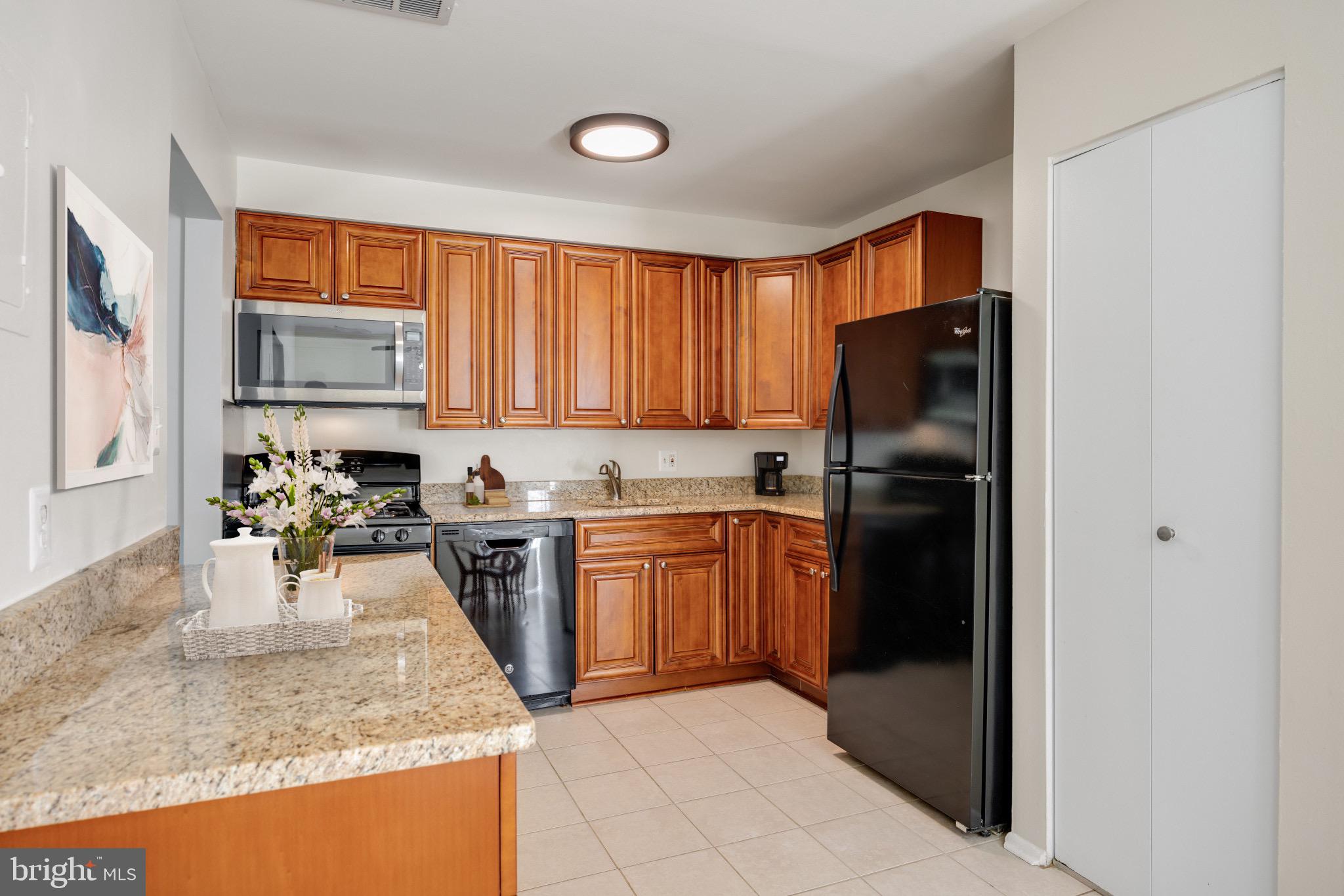14432 Parkvale Road, Unit 4 Rockville, MD 20853 - Photo 6 of 16 Granite Counters, Gas Stove, Newer Cabinetry