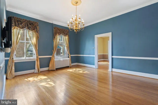 a kitchen with a sink appliances cabinets and a window