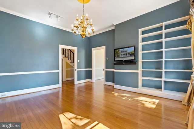 a kitchen with stainless steel appliances a sink stove and cabinets