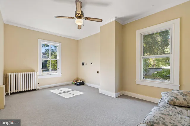 a view of livingroom with hardwood floor and ceiling fan